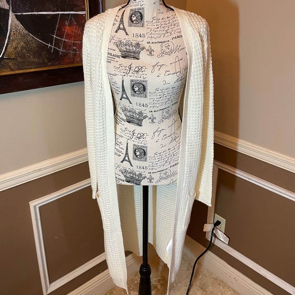 White knit cardigan. No stains. Hasn’t been worn.